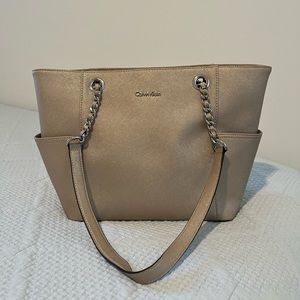 Shimmery tan Calvin Klein bag with silver hardware